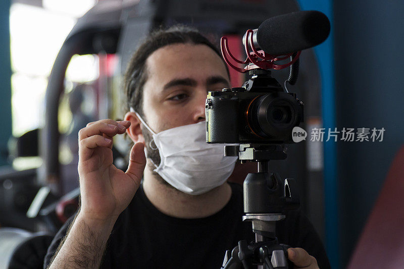 Photographer With Surgical Mask Behind The Camera